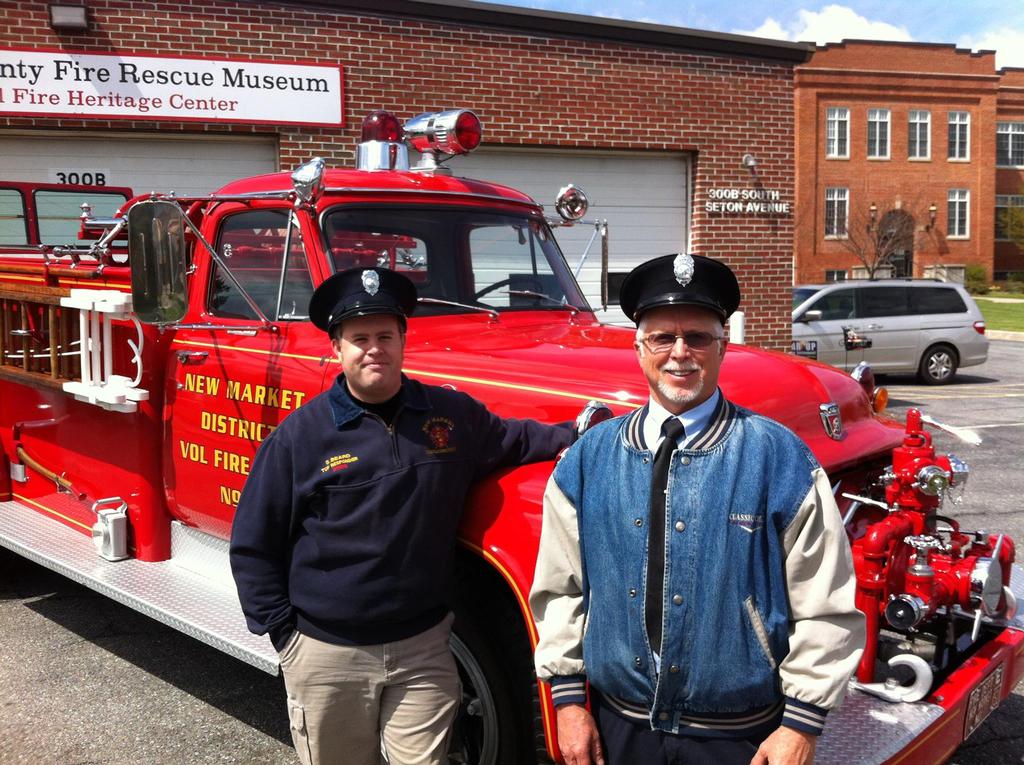 New Market District Vol. Fire Dept. members Chris Beard and Eddie Zimmerman with New Market fist engine 