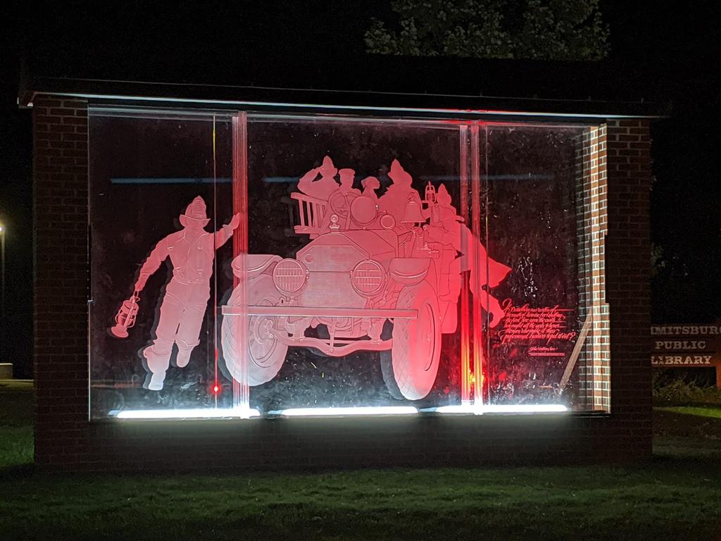 Glass etching &quot;Volunteers&quot; in special red lighting during the National Fallen Firefighter's Memorial Weekend