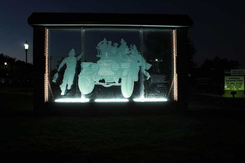 Glass etching &quot;Volunteers&quot; lighted during evening hours