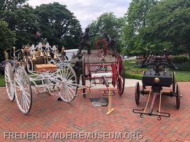 Museum artifacts "Romeo" Juniors 1876 Silsby hose reel and the "Old Lady" on display at Maryland Fire Rescue Memorial 